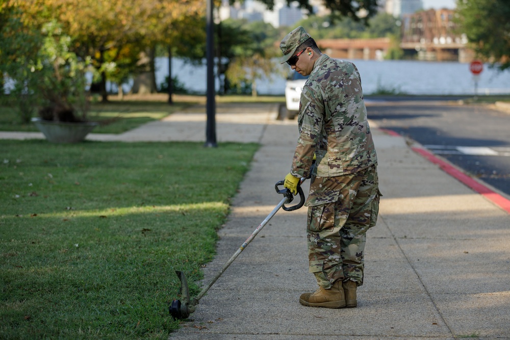Guardsman with the D.C. National Guard perform landscaping and trash cleanup at East Potomac Park