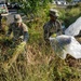 Guardsman with the D.C. National Guard perform landscaping and trash cleanup at East Potomac Park