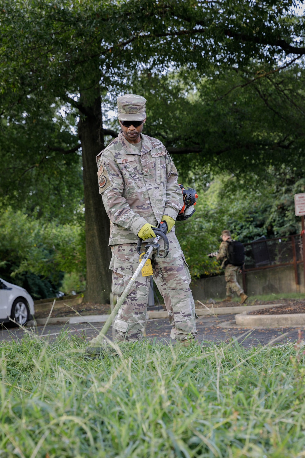 Guardsman with the D.C. National Guard perform landscaping and trash cleanup at East Potomac Park