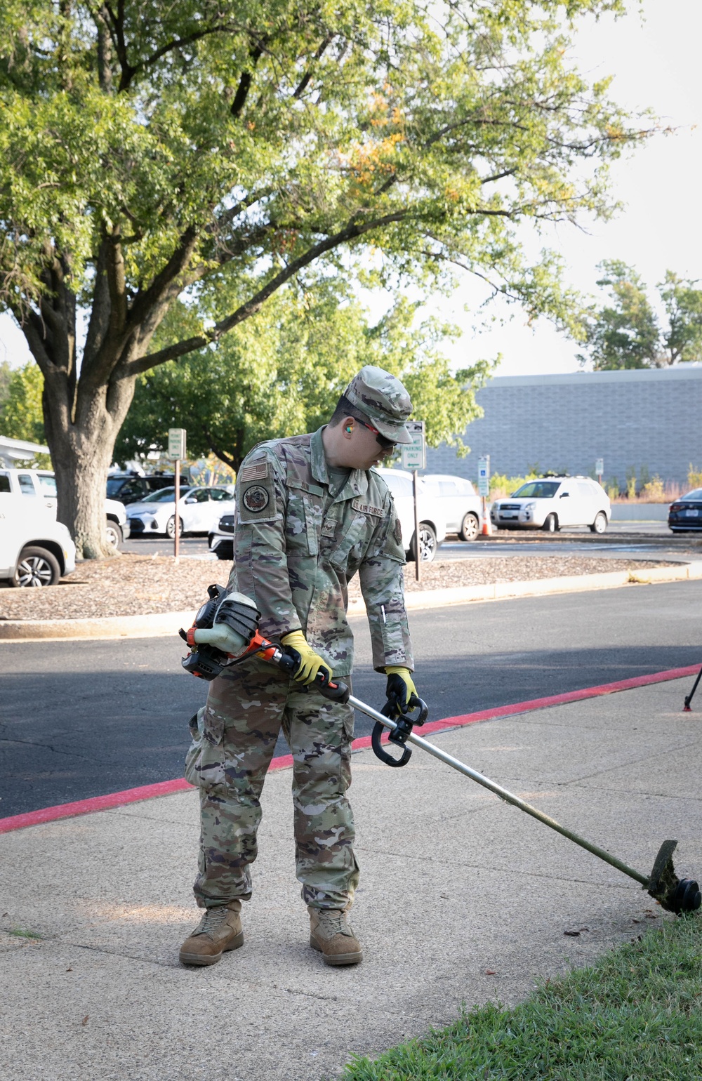 Guardsman with the D.C. National Guard perform landscaping and trash cleanup at East Potomac Park