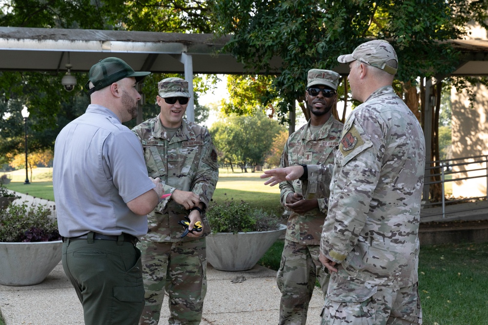 Guardsman with the D.C. National Guard perform landscaping and trash cleanup at East Potomac Park