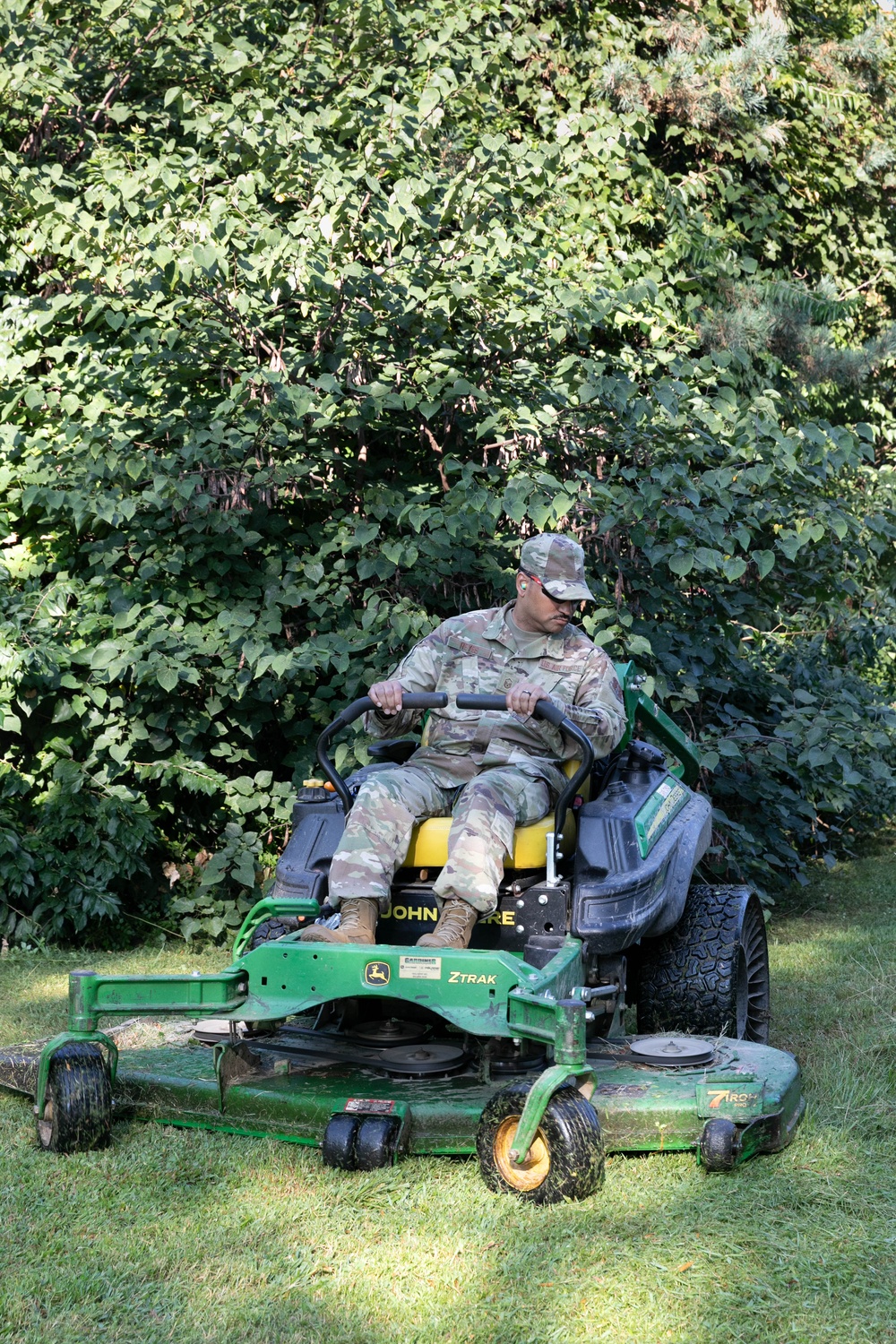 Guardsman with the D.C. National Guard perform landscaping and trash cleanup at East Potomac Park