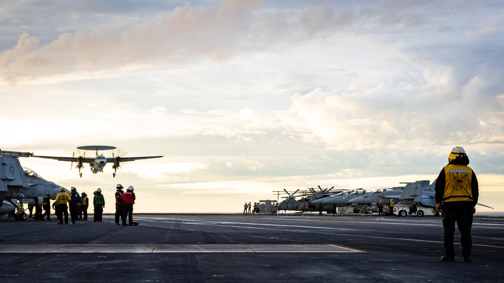 USS Gerald R. Ford (CVN 78) Sailor Observes E2-D Hawkeye Approach