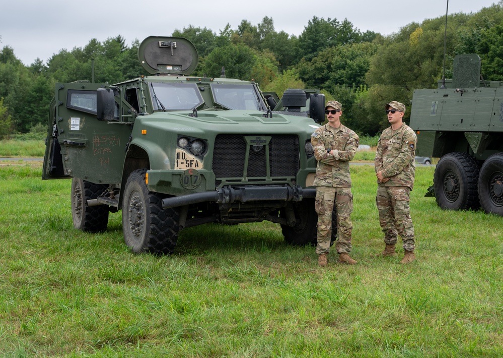 U.S. Army Soldiers stand at static equipment display