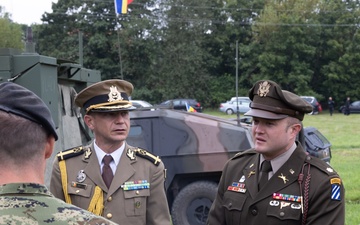 U.S. Army and Romanian leaders discuss static display with Croatian soldiers