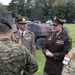 U.S. Army and Romanian leaders discuss static display with Croatian soldiers