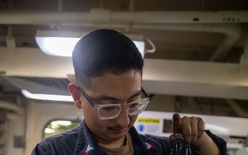 USS Gerald R. Ford (CVN 78) Sailor Conducts Maintenance
