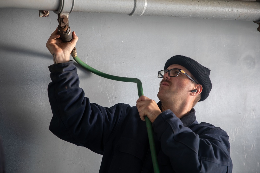 USS Gerald R. Ford (CVN 78) Sailor Conducts Preservation