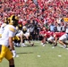 Iowa and Iowa State players lined up to hike ball at Cy-Hawk game