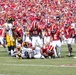 Iowa State defender stands over Iowa player at Cy-Hawk game