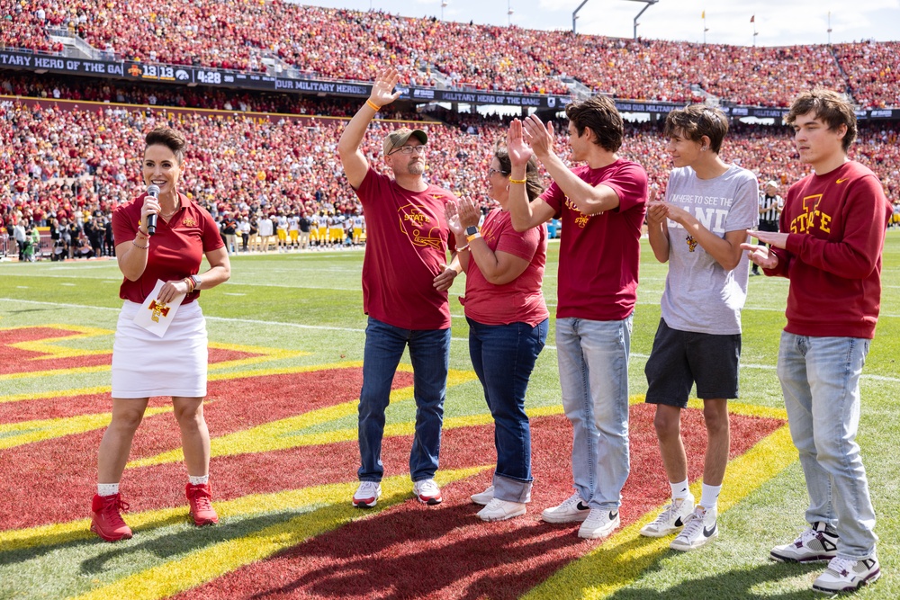Jackie Schmillen presents Hero of the Day at Cy-Hawk game