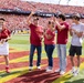 Jackie Schmillen presents Hero of the Day at Cy-Hawk game