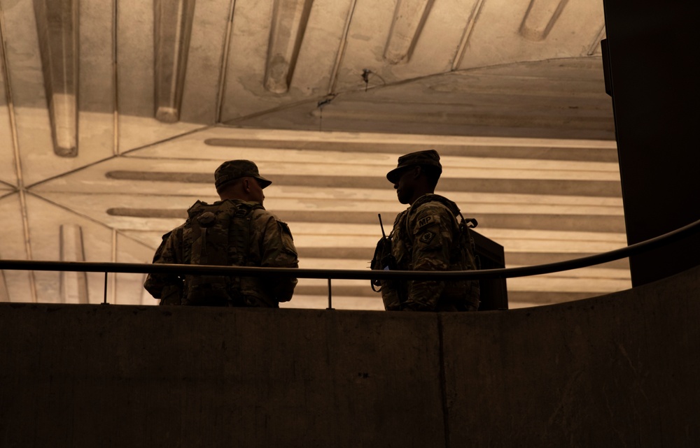 U.S. Soldiers with the 112th Military Police Battalion, Mississippi National Guard, Patrol the Gallery Metro