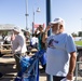 Veteran volunteer salutes during National Anthem at Five Seasons Stand Down