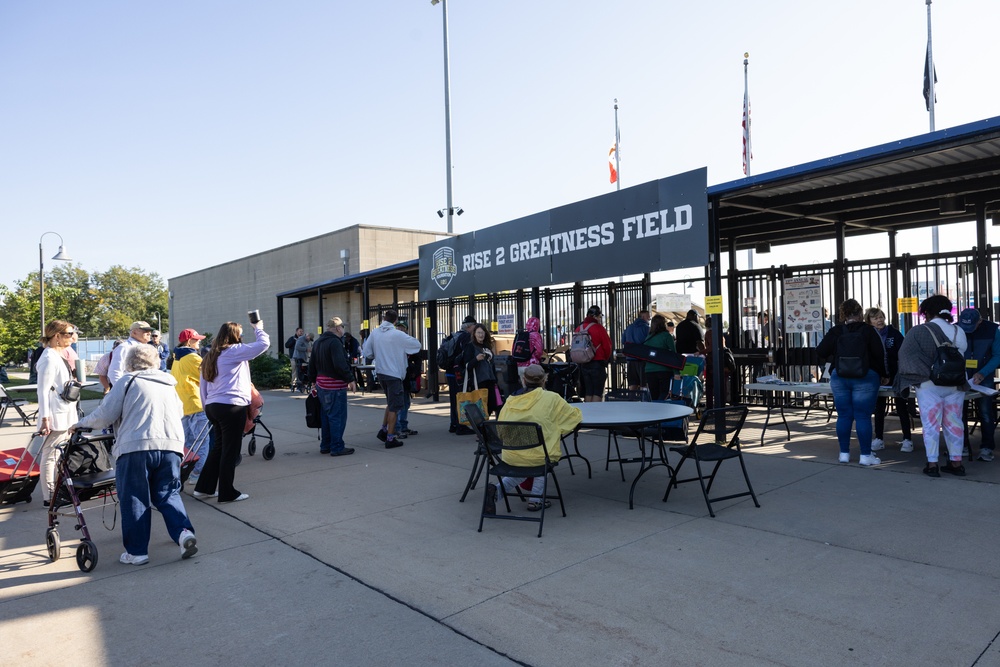 Participants enter Veterans Memorial Stadium for Five Seasons Stand Down