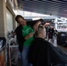 Volunteer hair stylist provides free haircut at Five Seasons Stand Down