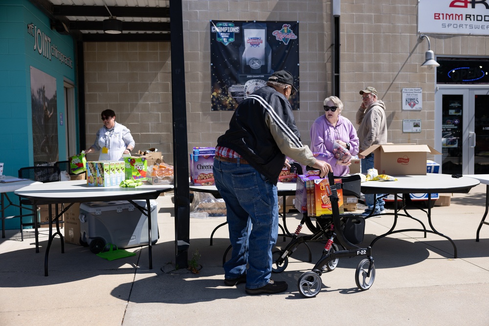 Volunteers distribute food at Five Seasons Stand Down