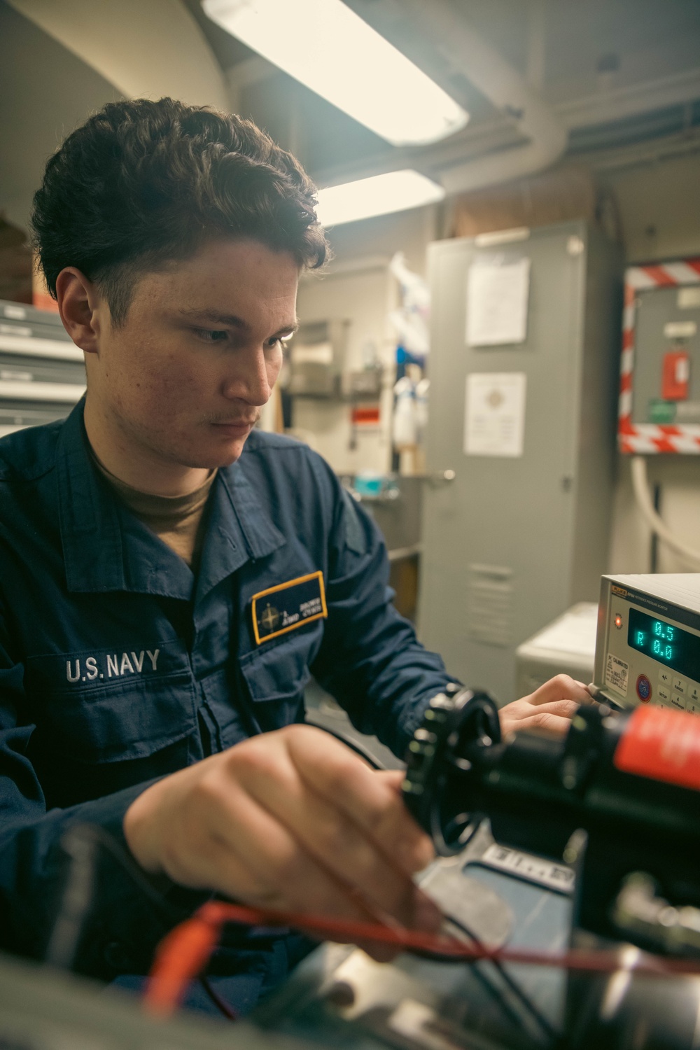 USS Gerald R. Ford (CVN 78) Sailor Conducts Maintenance