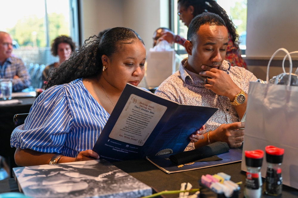 Participants Survey the Dinner Menu at a Strong Bonds Event