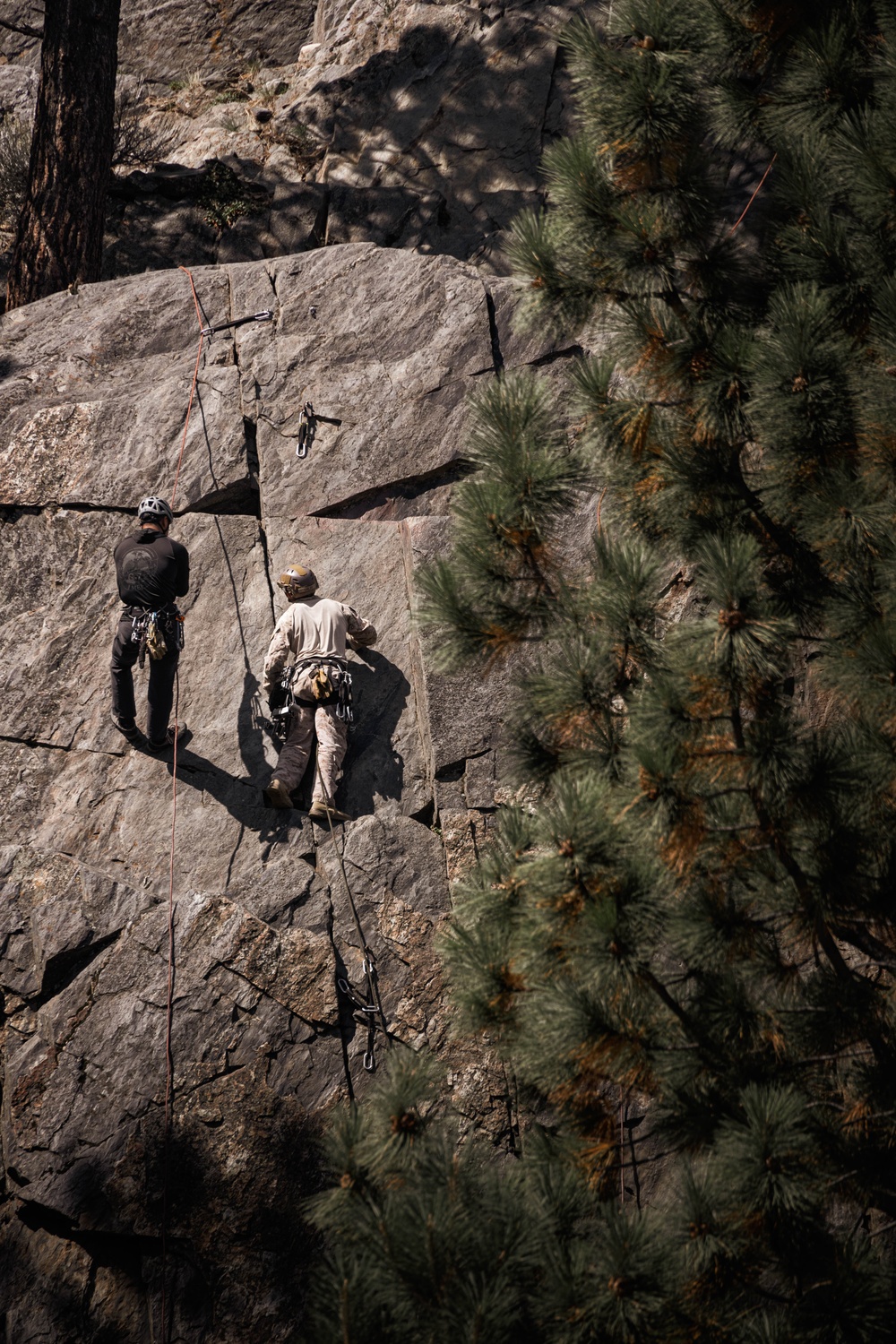 V35 and V11 Marines conduct lead climbing evaluation during Assault Climbers Course