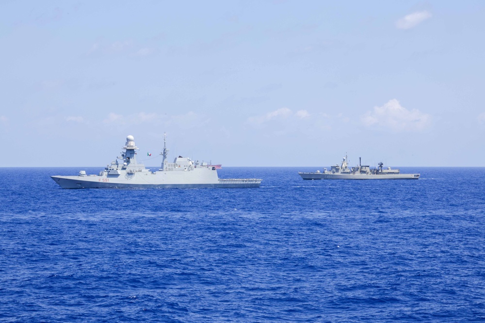 The USS Truxtun Sails in formation with partner nations