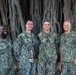 MU2 Caton Poses for a Photo with Band Leadership following Reenlistment