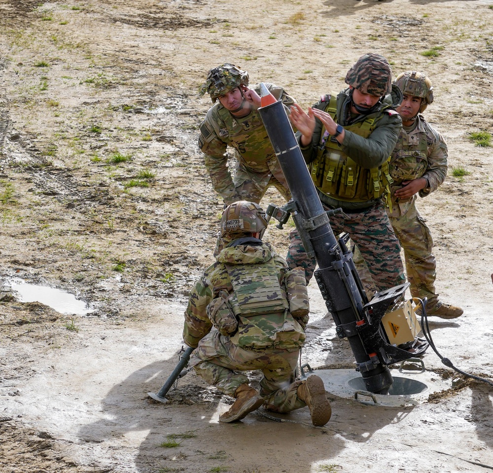 Indian and U.S. Army fire mortars together