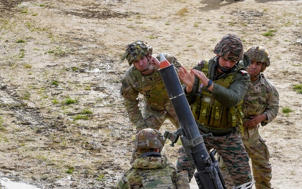 Indian and U.S. Army fire mortars together