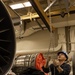USS Gerald R. Ford (CVN 78) Sailor Conducts Maintenance on a Jet Engine