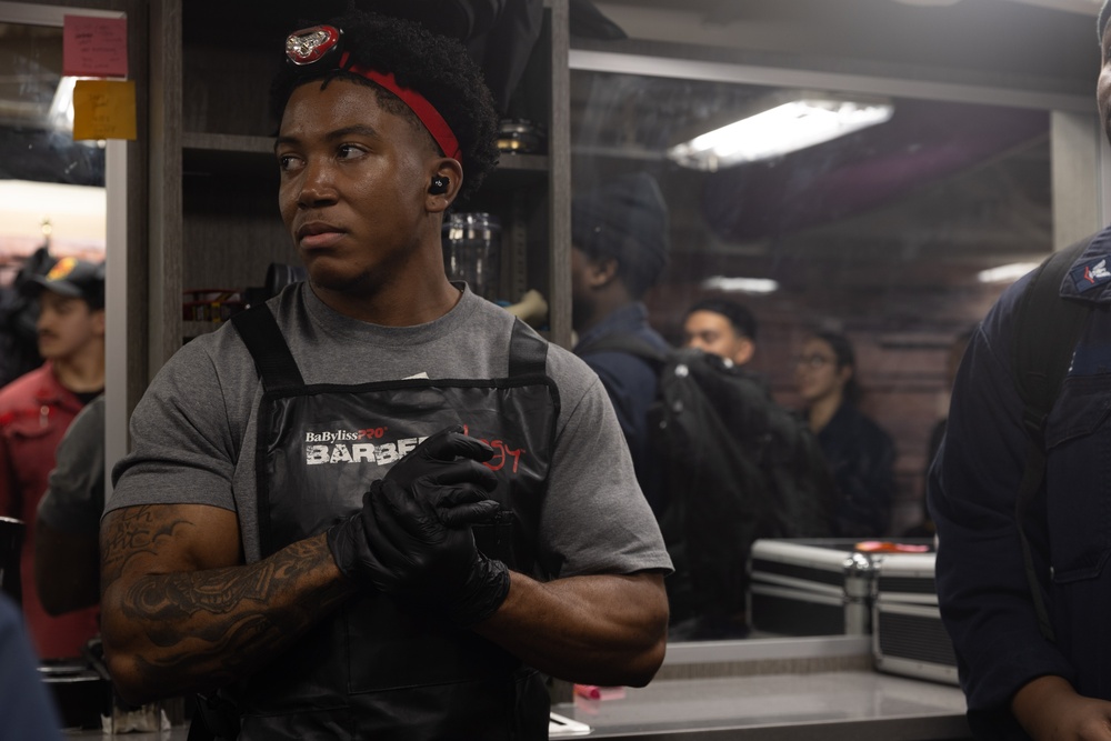 USS Gerald R. Ford (CVN 78) Sailor Participates in a Barber Competition