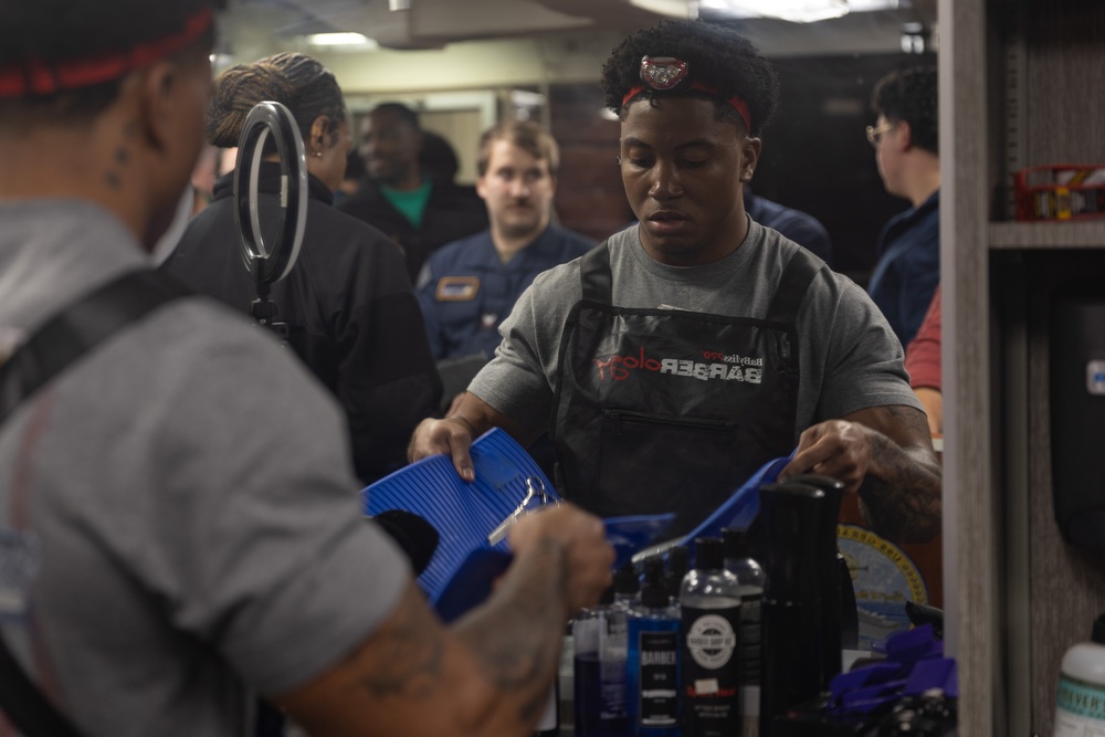 USS Gerald R. Ford (CVN 78) Sailor Participates in a Barber Competition