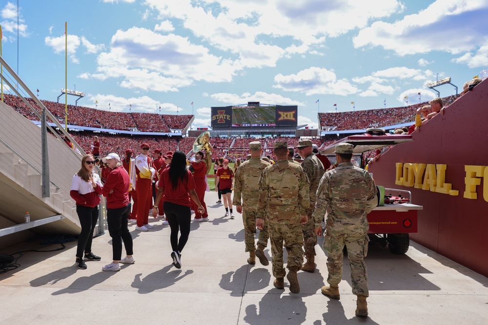 Iowa Army National Guard air crew walks into Jack Trice Stadium