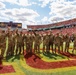 Iowa Army National Guard air crew waves at fans in Jack Trice Stadium