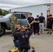 Fire Department Demonstrates Donning Fire Fighting Equipment