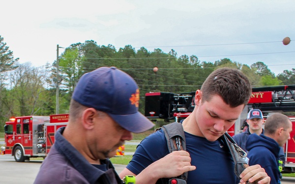 Fire Department Demonstrates Donning Fire Fighting Equipment