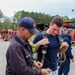 Fire Department Demonstrates Donning Fire Fighting Equipment