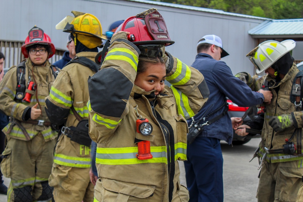 Delayed Entry Member Donning Fire Fighting Gear