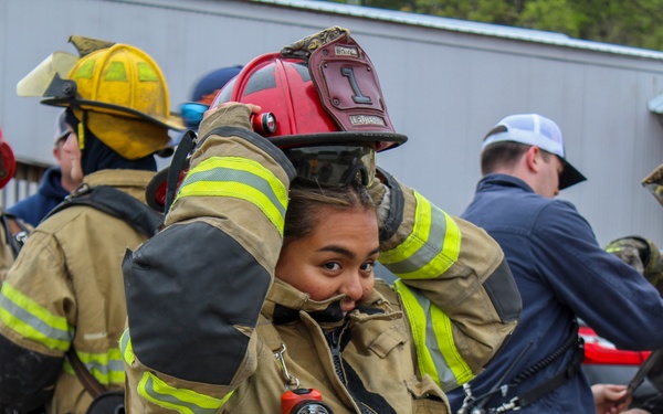 Delayed Entry Member Donning Fire Fighting Gear