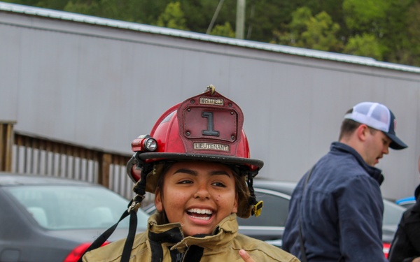 Delayed Entry Member Donning Fire Fighting Gear