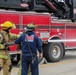 Delayed Entry Members Use A Fire Hose