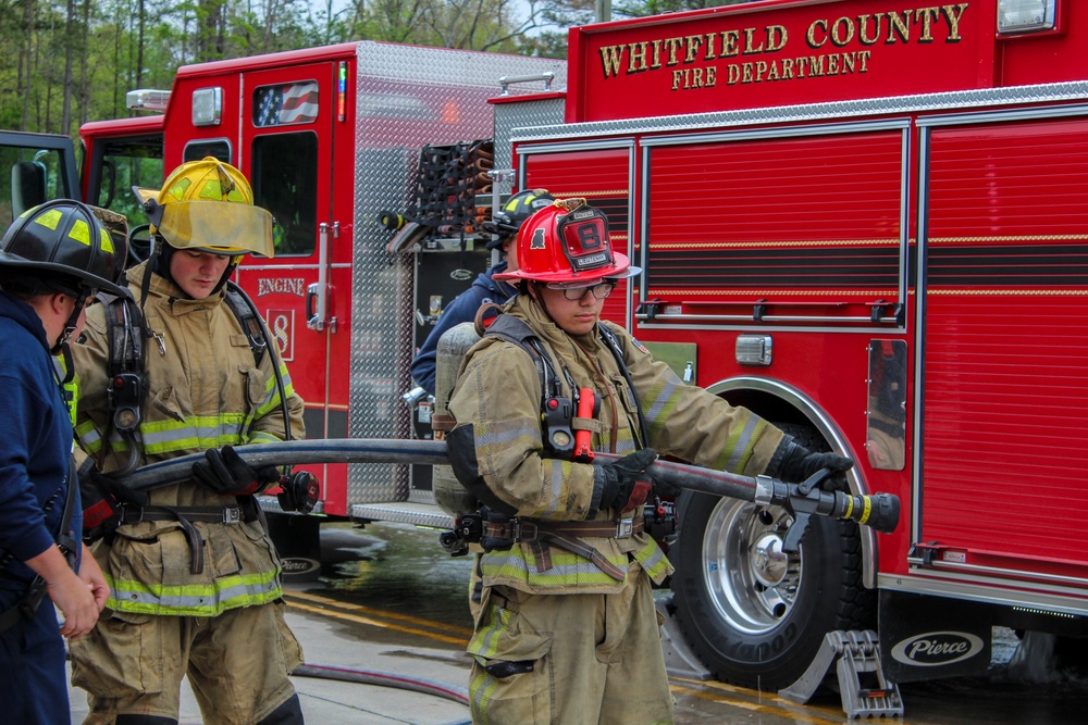 Delayed Entry Members Prepare To Use A Fire Hose
