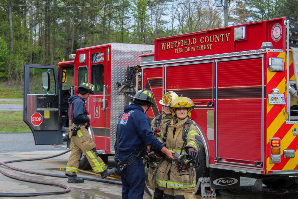 Delayed Entry Members Prepare To Use a Fire Hose