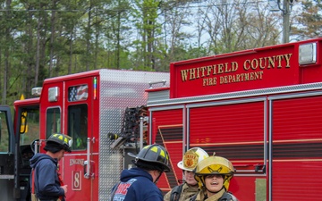 Delayed Entry Members Prepare To Use a Fire Hose