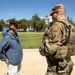 A U.S. Army Soldier, with the 112th Military Police Battalion, MS National Guard, speaks with a local resident at the National Mall