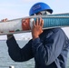 Sailors aboard the USS John Finn conduct a sea and anchor detail In Changi, Singapore