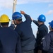 Sailors aboard the USS John Finn conduct a sea and anchor detail In Changi, Singapore