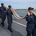 Sailors aboard the USS John Finn conduct a sea and anchor detail In Changi, Singapore