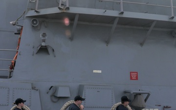 Sailors aboard the USS John Finn conduct a sea and anchor detail In Changi, Singapore