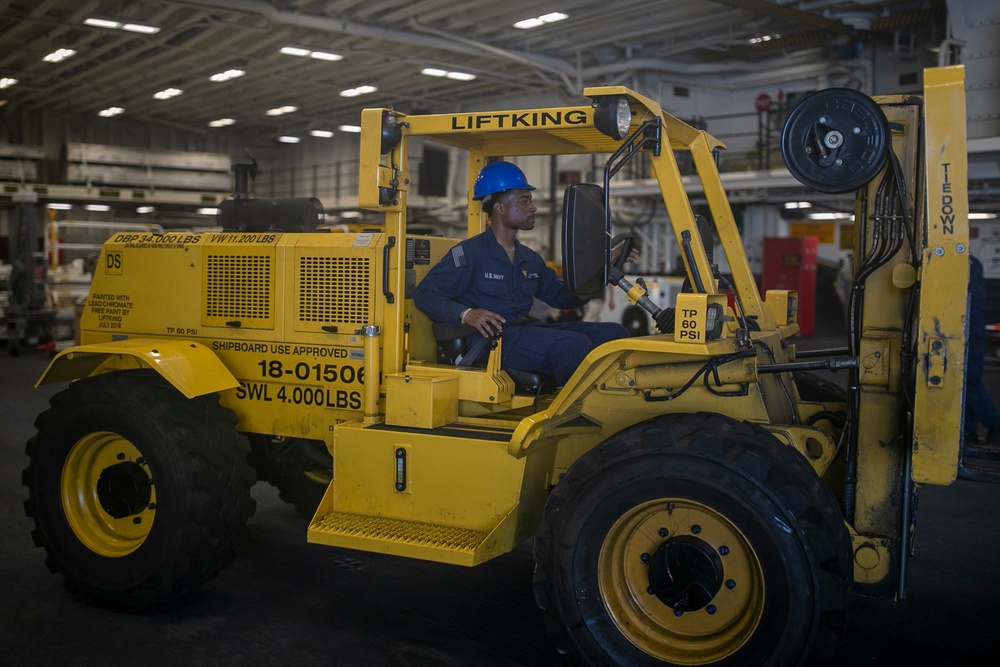 USS Tripoli Sailors Preform Maintenance