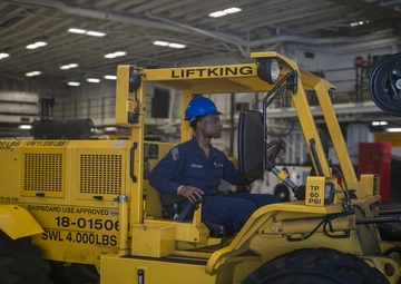 USS Tripoli Sailors Preform Maintenance